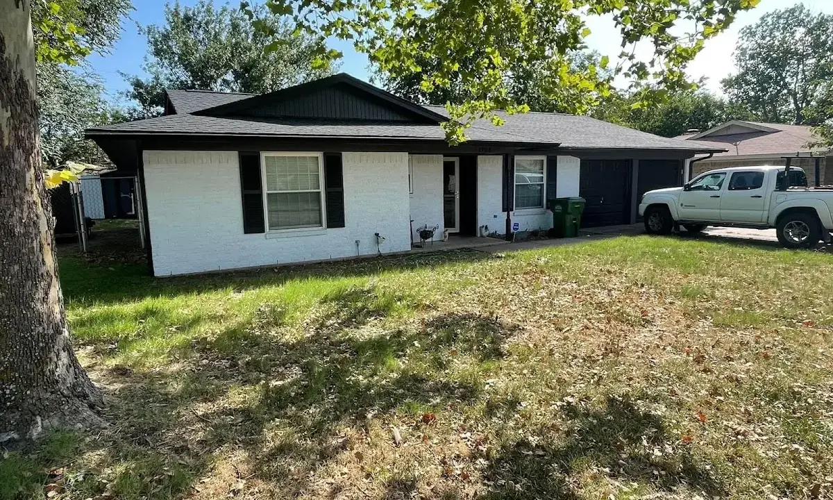 Professional roofing crew working on a residential roof in Belle Chasse
